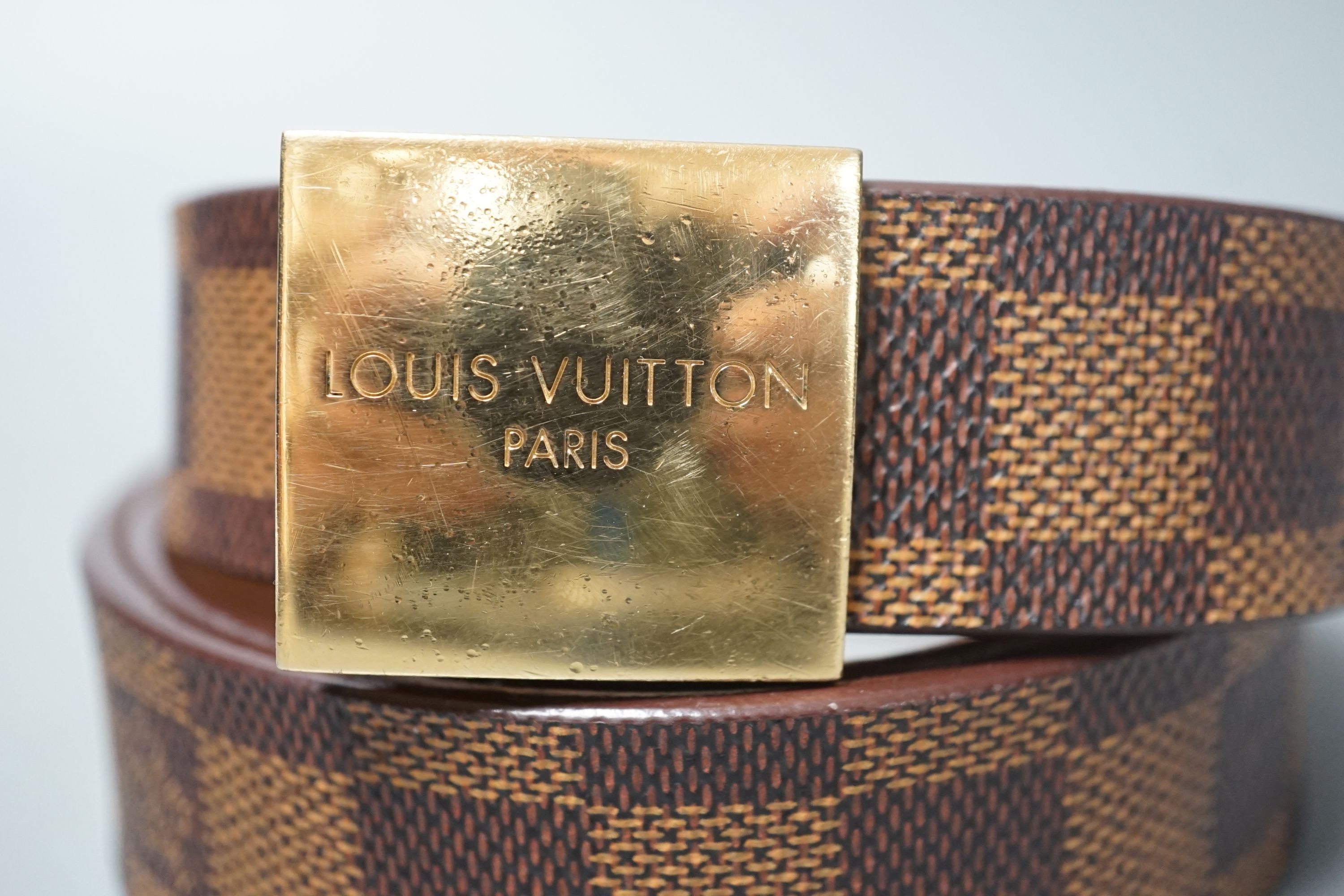 A brown leather women’s Louis Vuitton Damier pattern belt, in original box